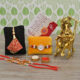 Craftam Rakhi Gifts for Brother Combo Set- Ganesha Idol, Raksha Bandhan Greeting, Roli Rice Pack and 4 Rakhi (for Bhaiya, Bhabi and 2 Children)